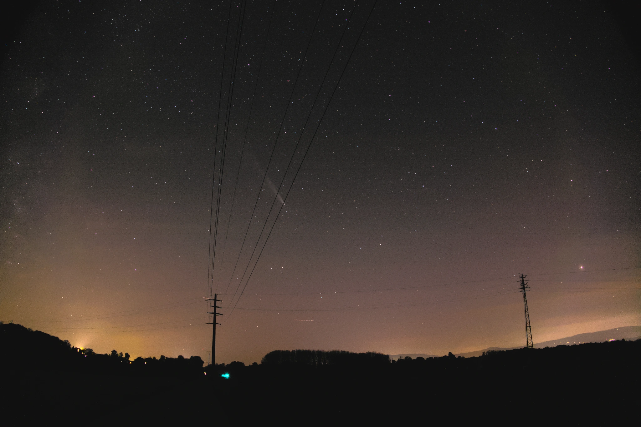 Comet TSUNCHINSHAN ATLAS-12 or something like that (I don't rember the name) above a natural scene with some power lines